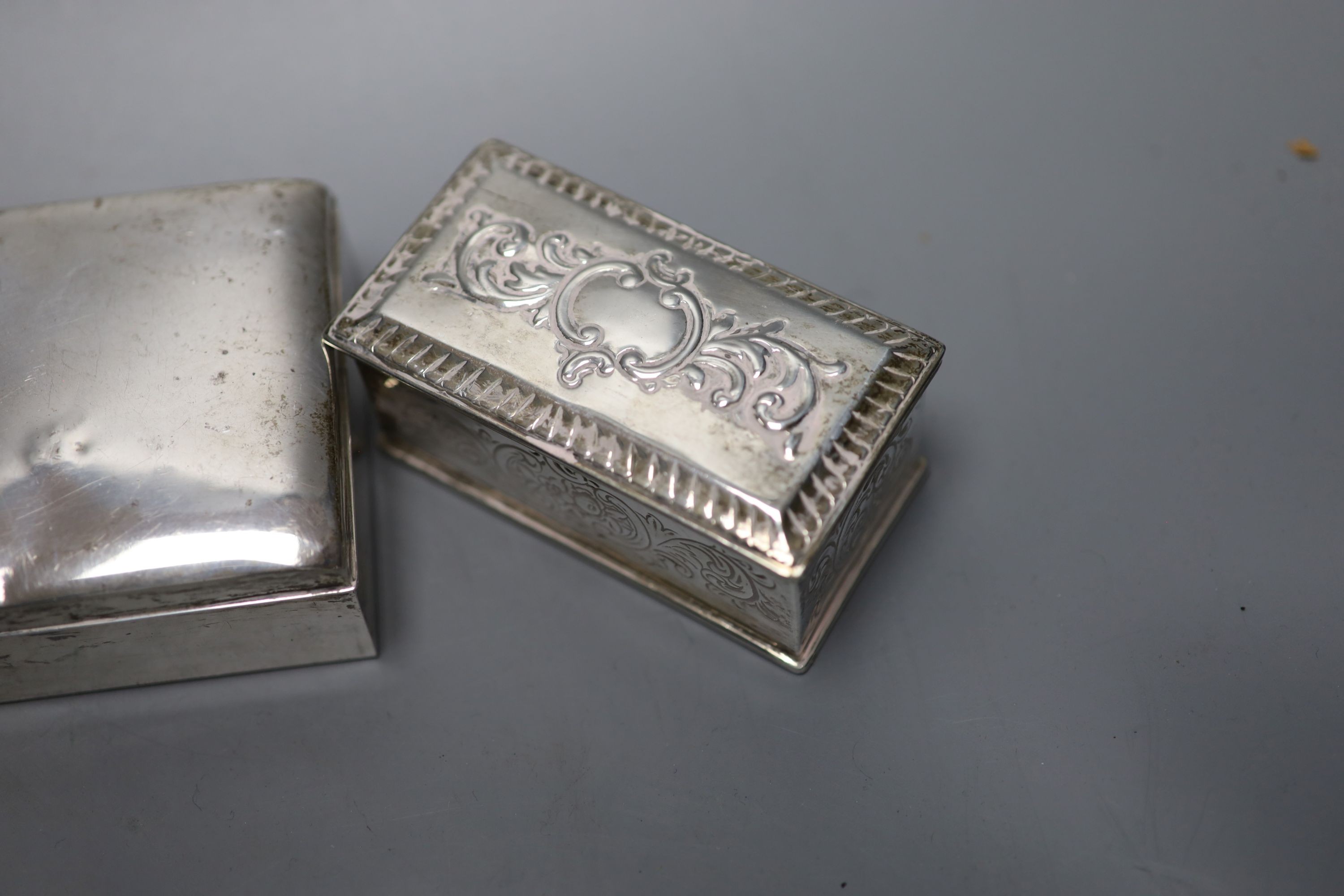 A sterling cigarete box, 9.5cm, a 900 white metal cigarette case and a late Victorian silver box and cover.